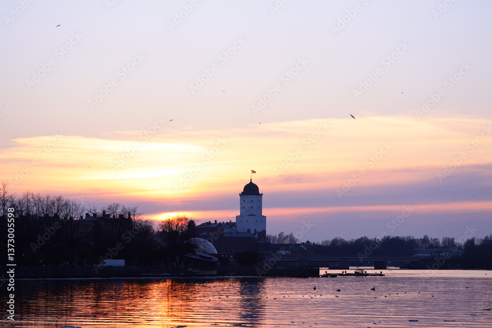 Poster a serene waterfront scene featuring a clock tower in the background, perfect for use in travel or ci