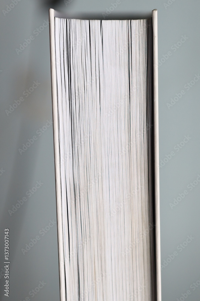 Poster a close-up shot of a book sitting on a table, perfect for illustrating a reading scene or academic s