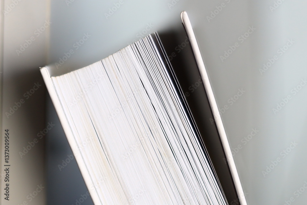 Poster A close-up view of a book lying on a table.