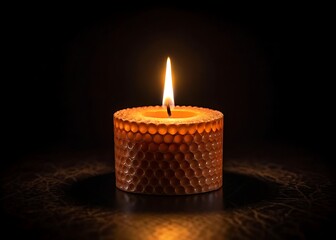 A single beeswax candle burns brightly in the dark, offering solace and warmth, a symbol of hope and remembrance with soft, warm lighting and a dark background.
