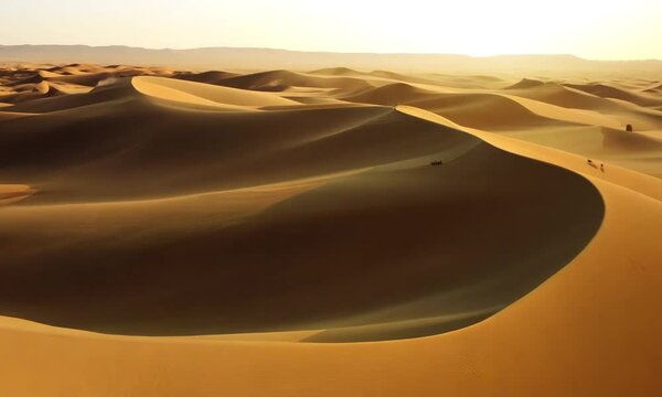 Aerial view on big sand dunes in Sahara desert at sunrise