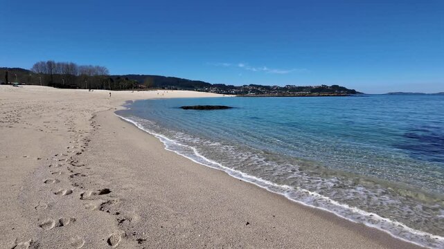 Serene Beach with Tranquil Clear Waters and Sand in Bueu