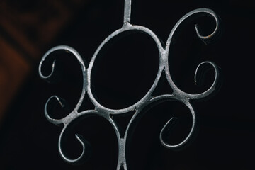 Decorative Wrought Iron Detail on Dark Background