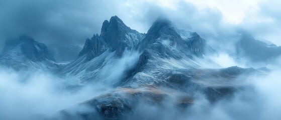 Fototapeta premium Misty mountains, serene peaks, ethereal blue hues.
