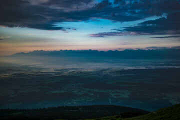 cloudy sunrise on Babia Góra with a view of the Tatra Mountains panorama
