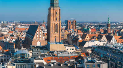 Aerial view of Wroclaw, Poland, showcasing St. Elizabeth's Church, colorful Old Town buildings, and...
