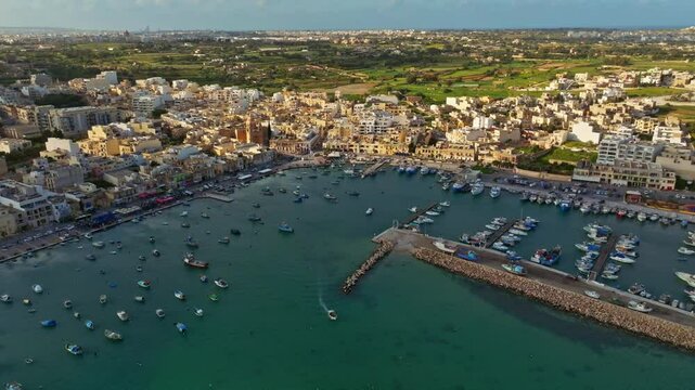 Traditional fishing Marsaxlokk village. Maltese island, drone day view