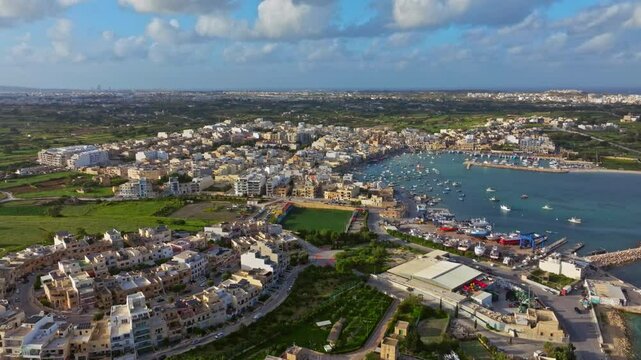 Traditional fishing Marsaxlokk village. Maltese island, drone top view