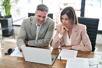 Two professional busy business partners executive leaders managers of middle age working in office...