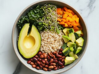 Vibrant salad bowl filled with colorful ingredients, including avocado, beans, quinoa, and other fresh vegetables. A balanced meal in one dish.