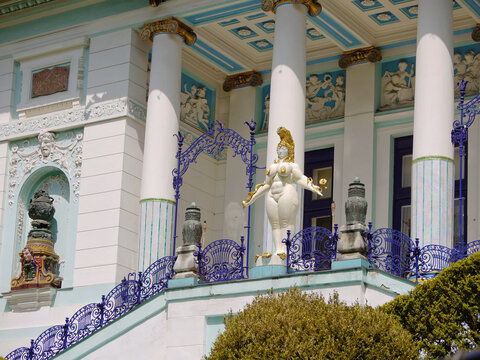 Vienna, Austria - 17 May 2019: Otto Wagner Villa, Ernst Fuchs Museum in Vienna. The main entrance with columns and statue of Queen Esther. Fantastic realism art style