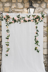 Arch decoration of flowers on white background for photographing newlyweds and guests