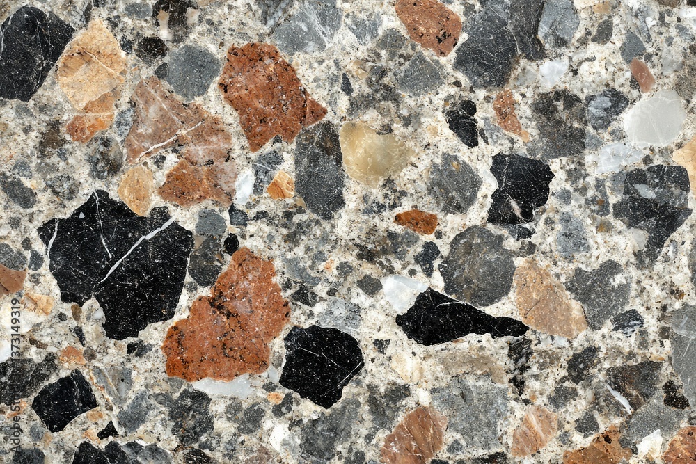 Aufkleber A high-resolution close-up of a terrazzo surface featuring a mix of colorful stone fragments in various sizes.