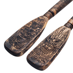 Close-up of dragon boat oars with intricate designs, isolated on a transparent background.