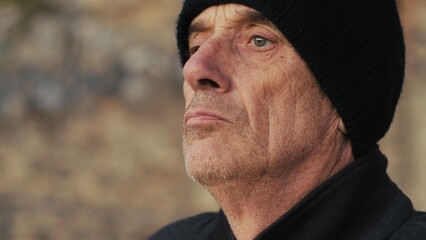 Elderly Man With Woolen Hat Looks At The Panoramic View