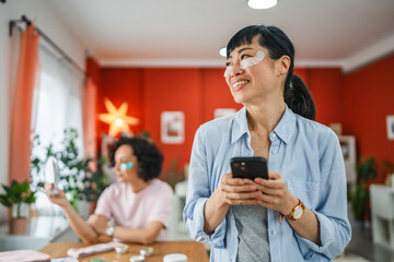 beautiful mature japanese woman with eye patches use mobile phone