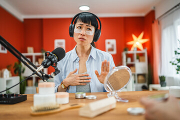 japanese woman hosts a show about skin care product at home studio