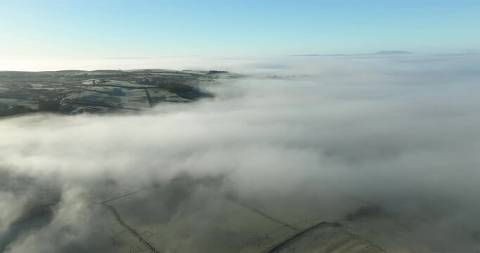 Aerial shot of fog over Malhamdale