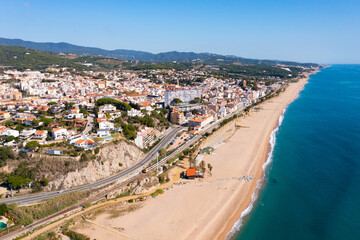 Aerial view from drone of Canet de Mar beach on sunny autumn day in Catalonia, Spain
