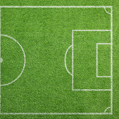 Fototapeta premium Football field with markings on green turf