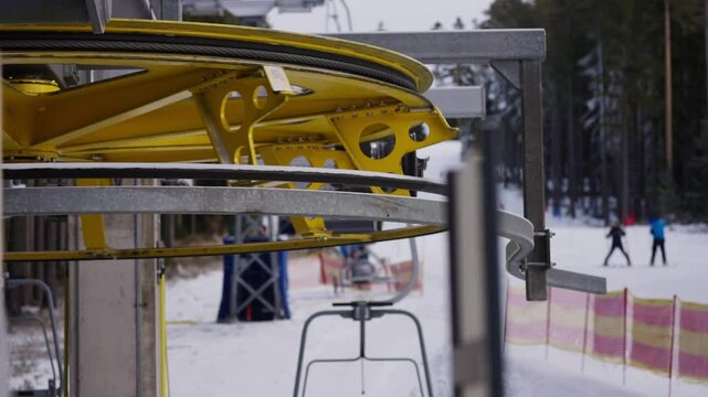 Detail of ski lift wheel in slowmotion in winter