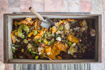 Organic compost bin filled with food scraps and garden waste