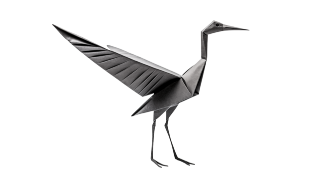 Origami bird with outstretched wing against black backdrop