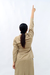 Rear view of asian civil servant woman pointing above. Isolated on white background.
