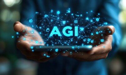 A person is holding a cell phone with the word AGI on it