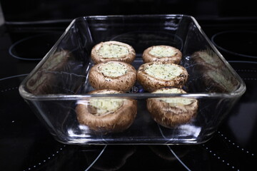 grilled mushroom in square clear glass plate