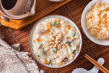 Minced pork congee with preserved egg on the table 