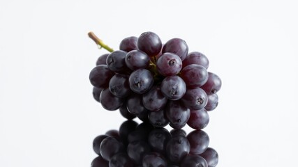 Fototapeta premium Fresh Blue Grapes with Water Droplets on White Background – Close-Up