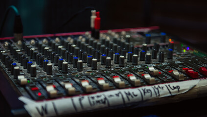 Mixer control and music engineer. Backstage controls on an audio mixer, sound mixer. Professional...