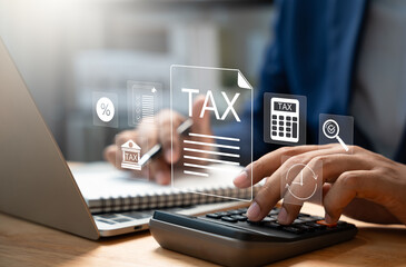Tax and Vat concept. Government, state taxes concept. Businesman using calculator and laptop to complete Individual income tax return form online for tax payment. Data analysis, financial research.