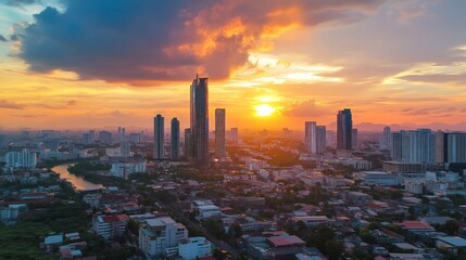 Fototapeta premium Sunset cityscape over skyscrapers urban landscape aerial view vibrant colors modern metropolis