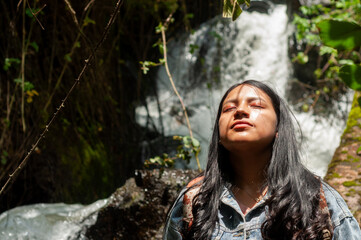 Embracing the Beauty of Nature A Serene and Peaceful Moment by a Beautiful Waterfall in the Forest
