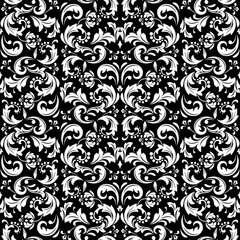 Wallpaper in the style of Baroque. White and black floral ornament. Seamless vector background. Graphic pattern for fabric, wallpaper, packaging. Ornate Damask flower illustration.