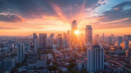 Fototapeta premium Sunrise over urban skyline city landscape aerial view morning glow modern architecture