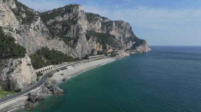 aerial retreat along the coastal highway at Spiaggia del Malpasso, Italy