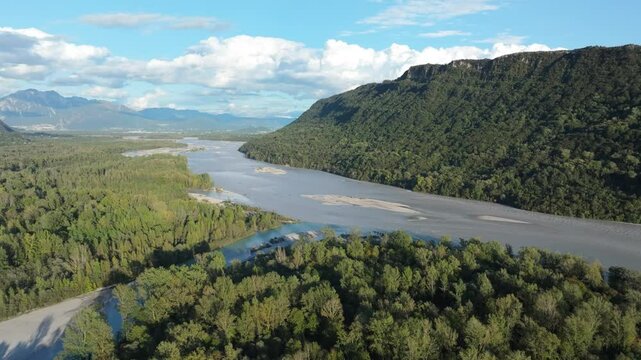 sideways aerial of the majestic Tagliamento River and wilderness area that is rare in Europe