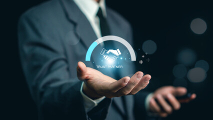 Trusted partner. Trustworthy collaboration, company or contract. Confidence to work together. Businessman turning knob to highest trust levels. Build trust in business and finance relationships.