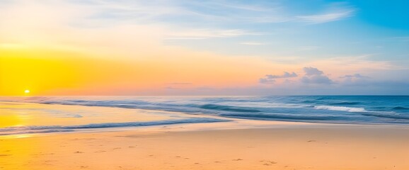 Fototapeta premium Serene sunrise paints the tranquil beach with golden hues, creating a peaceful coastal scene of soft waves and warm light.