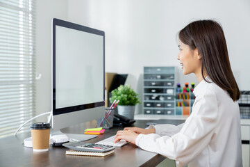 Business woman hand using computer and type on the keyboard. Mockup screen of advertisement.