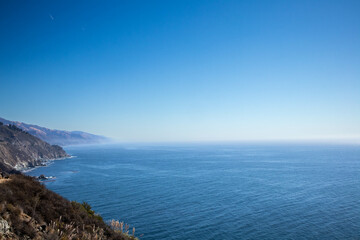Expansive Pacific Ocean view from cliffs Big Sur, California coastline