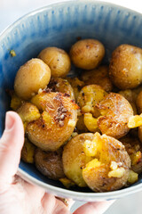 Bowl of Crispy Smashed Potatoes with Garlic and Salt