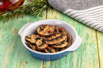 Tasty hot grilled champignon mushrooms