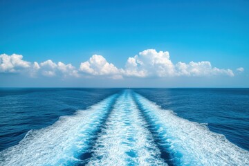 Serene Ocean Waves and Clear Blue Sky with Fluffy White Clouds