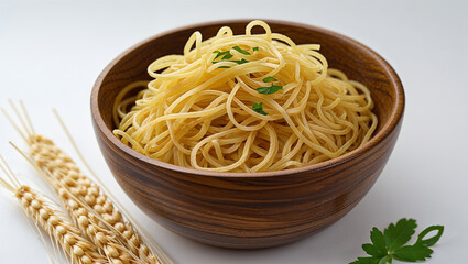 Cooked spaghetti in wooden bowl with wheat stalks and parsley
