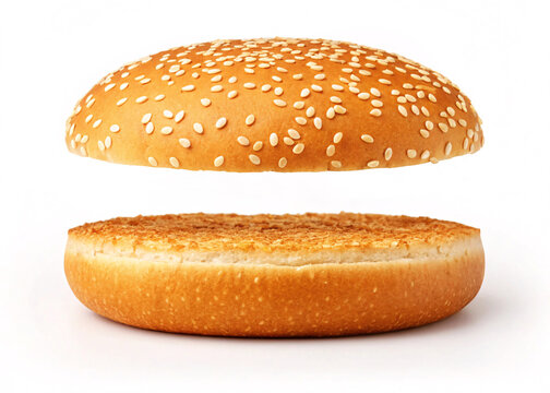 Halved sesame seed burger bun with floating top on white background