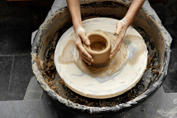 Close-up of hand-pull-making ceramics